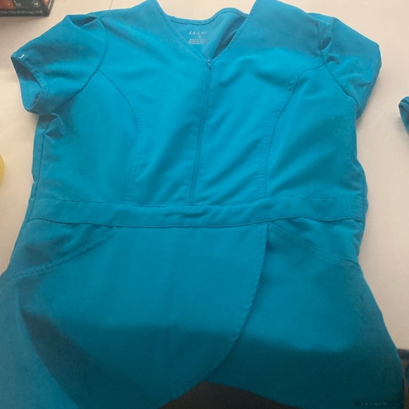 First picture is not the color I have. I have teal small top and medium bottoms - Picture 2 of 5